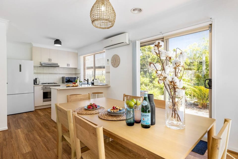 The open plan kitchen and dining area is perfect for entertaining and kept temperate with split-system heating and cooling.