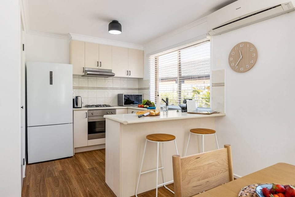 The kitchen is fully-equipped for your holiday catering, offering all the essentials plus a Nespresso machine. Pull up a seat the breakfast bar for a quick bite to eat before hitting the beach.