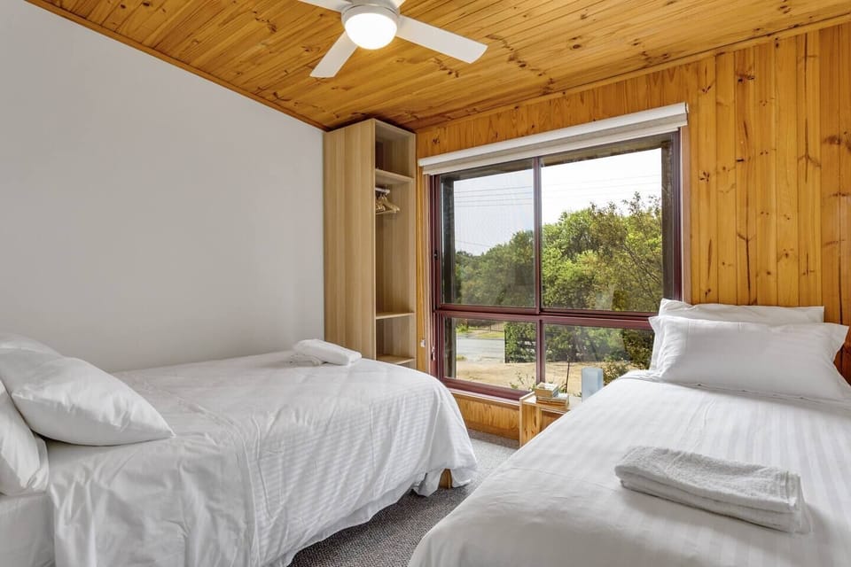 The third bedroom sleeps three, with a double and single bed set under a ceiling fan to provude maximum comfort.
