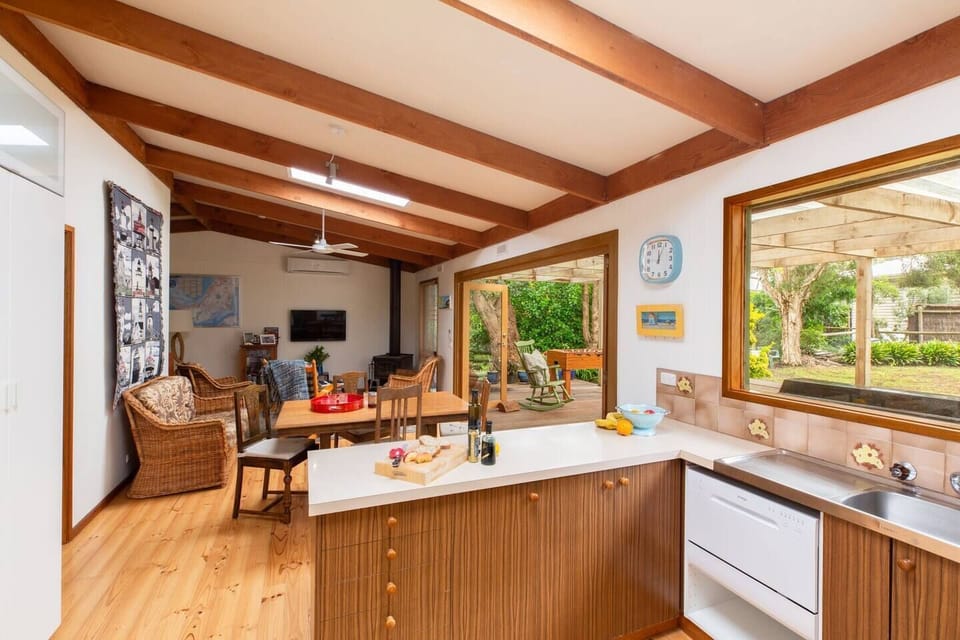 Skylights and an abundance of windows drench the space in natural light.