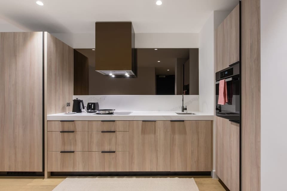 Whether you're exploring the local dining scene or cooking at home, the sleek and streamlined kitchen is fully equipped for your culinary needs.