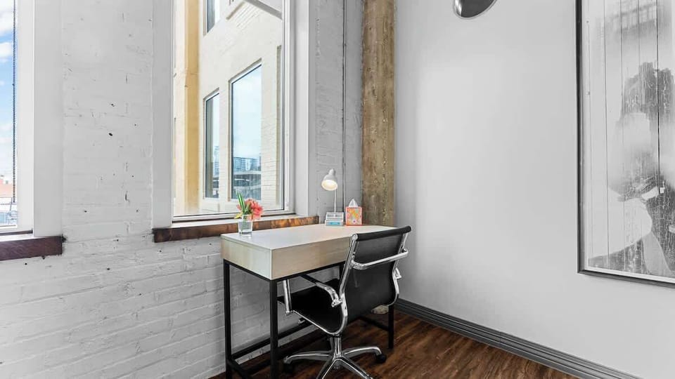 Workspace Retreat: Bright corner desk with scenic views, perfect for inspiration and productivity!