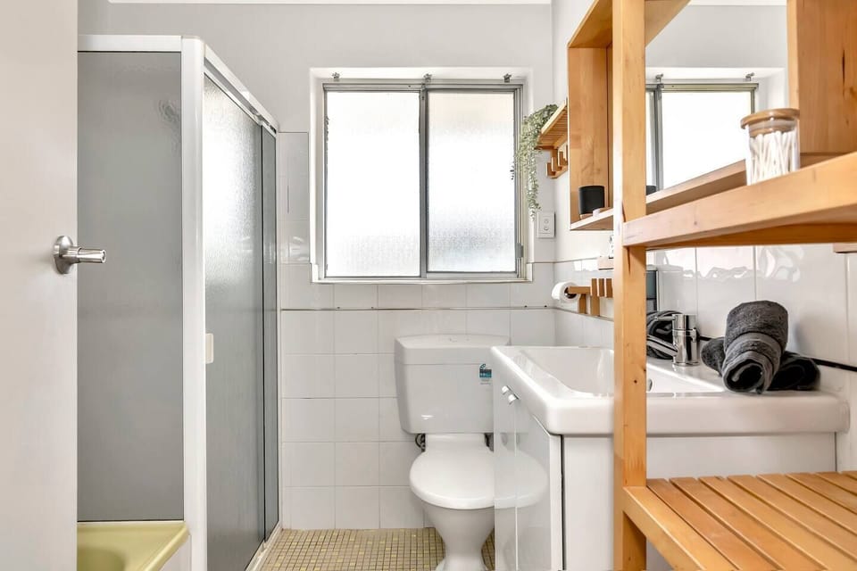The main bathroom is located upstairs and includes a shower, bathtub and complimentary toiletries. 