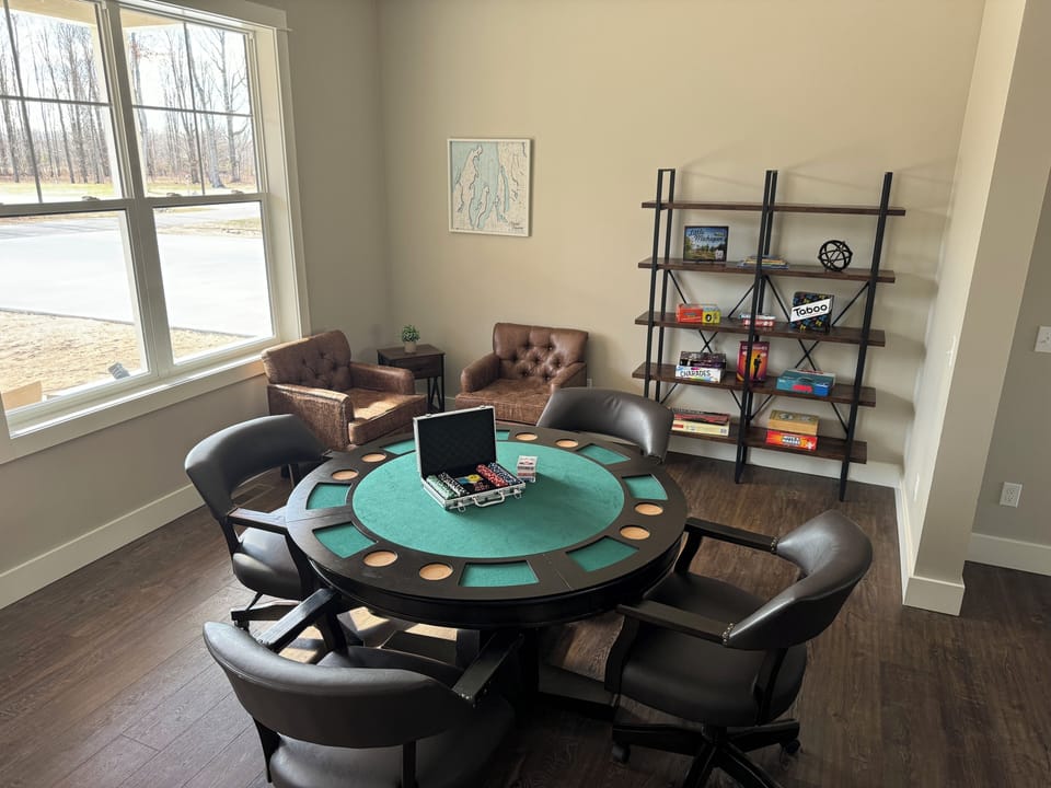 Game room with card table complete with poker set and games and view of the TV