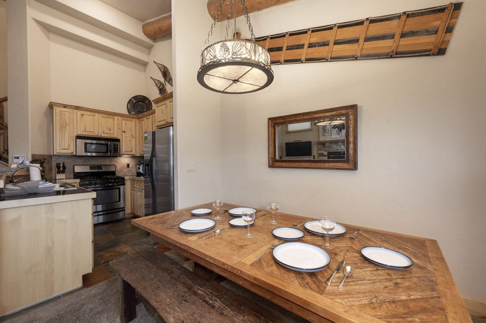 - Spacious dining room with a handcrafted wooden table   - Seating for group meals and family celebrations   - Rustic charm paired with modern comfort for mountain dining