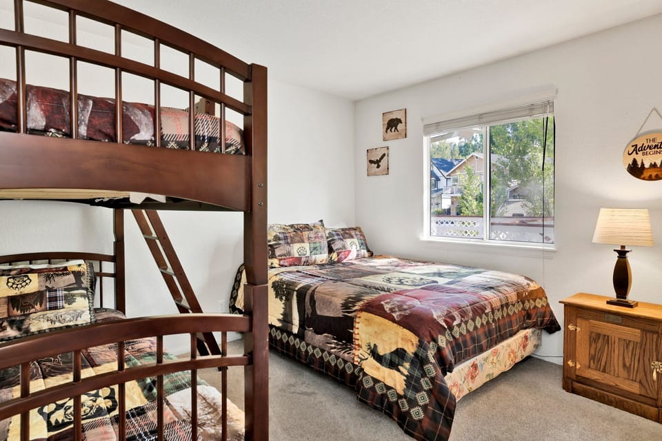 Guest bedroom with queen size bed and twin over twin bunkbed
