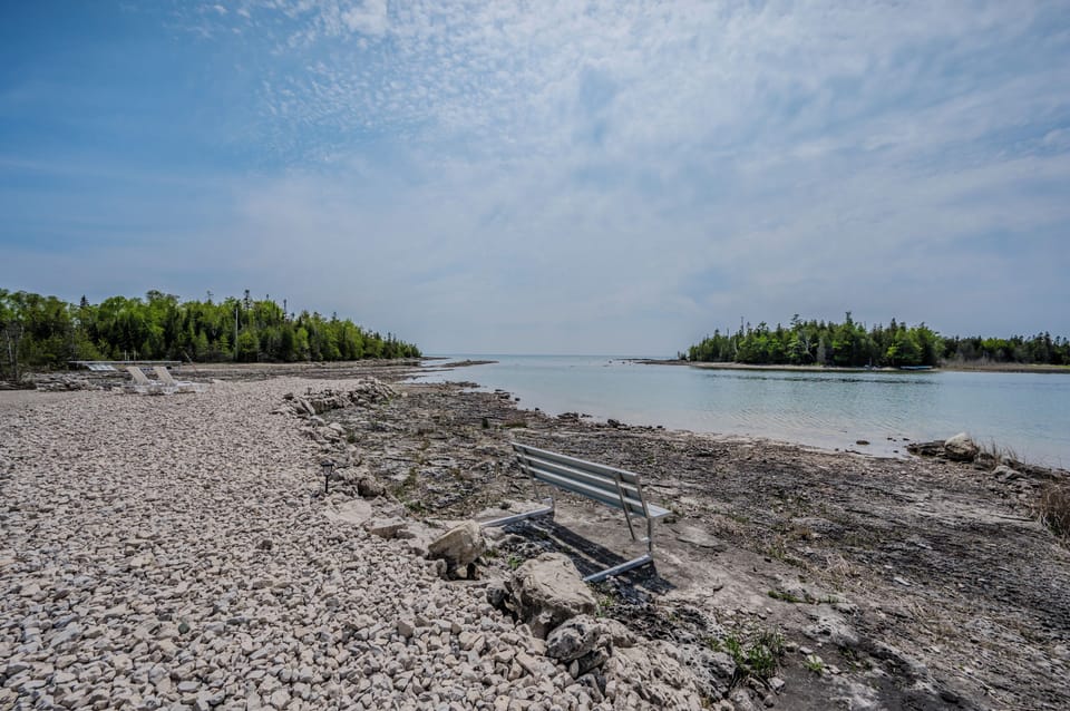 Enjoy the private beach with lounge chairs. A serene spot on Lake Huron’s shore, perfect for soaking up the sun.