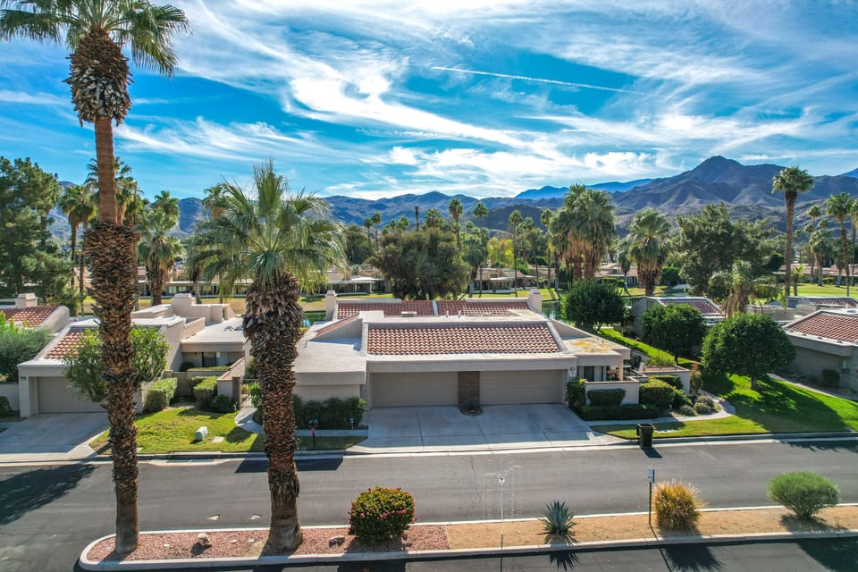 Palm Springs neighborhood with mountain views and desert landscaping