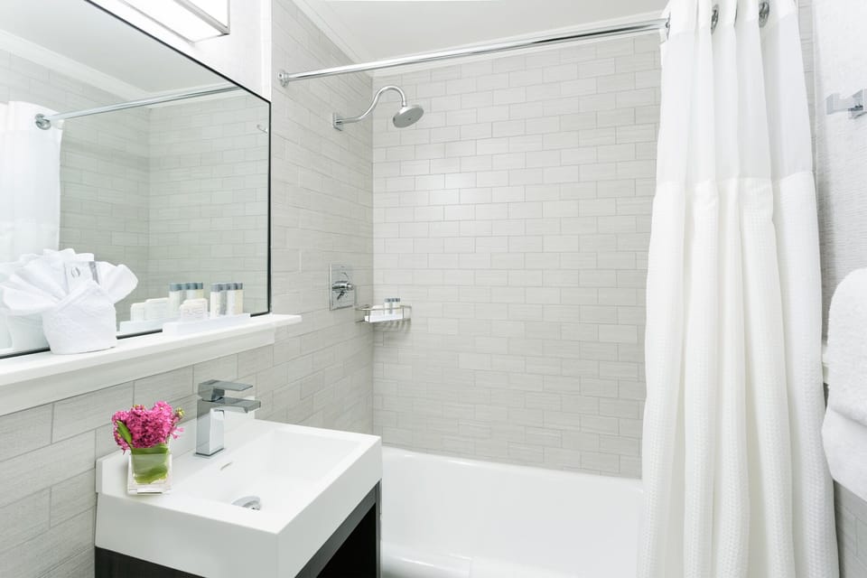 Rinse off in a spotless, spa-bright bath and shower combo.
