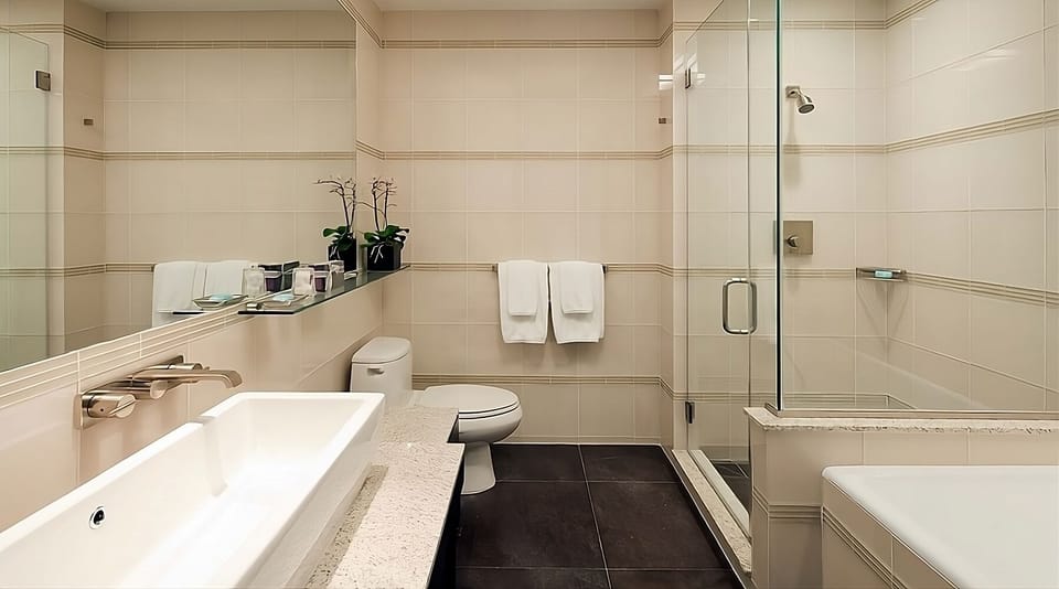 Rinse off in a glass shower with crisp, hotel-fresh towels.
