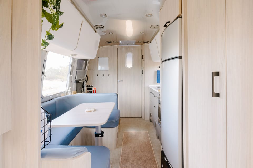 Bedroom perspective with bathroom door directly ahead.