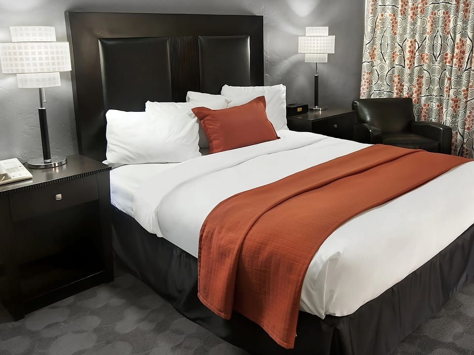 Settle in with bedside lighting and plush pillows for deep sleep