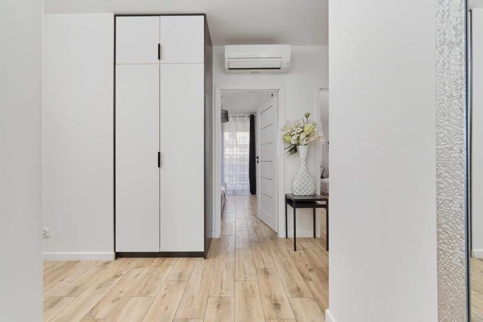 The living room's modern and stylish decor creates a welcoming atmosphere. 