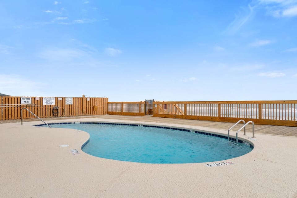 Dive into your shared pool oasis, where endless blue skies meet sparkling blue beneath your feet.