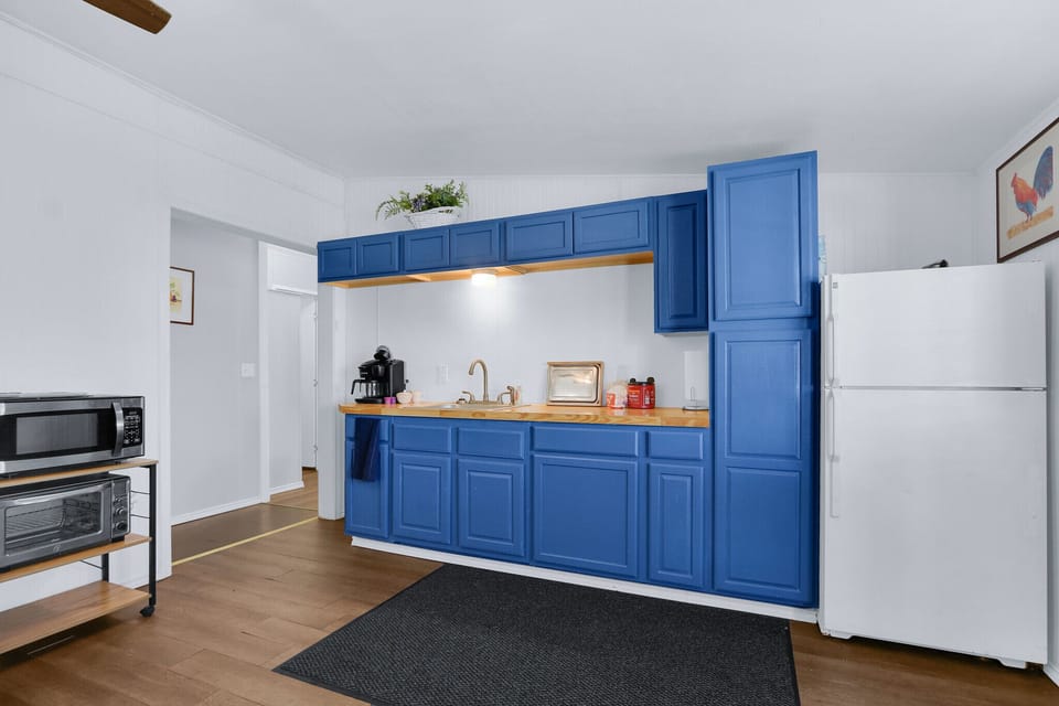 The hallway to the left of the kitchenette leads to the bedrooms and bathroom