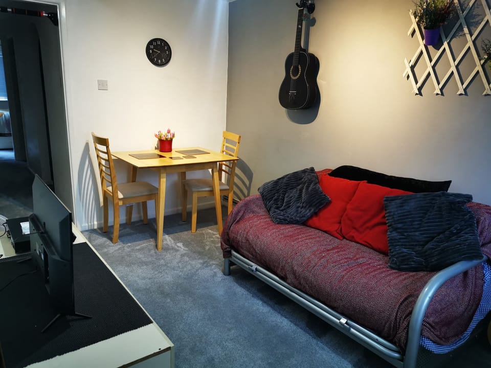 Living room / dining room. Feel free to play guitars!