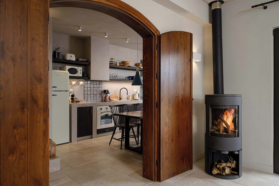 Welcoming Entrance Hall with Firestove and Kitchen Access