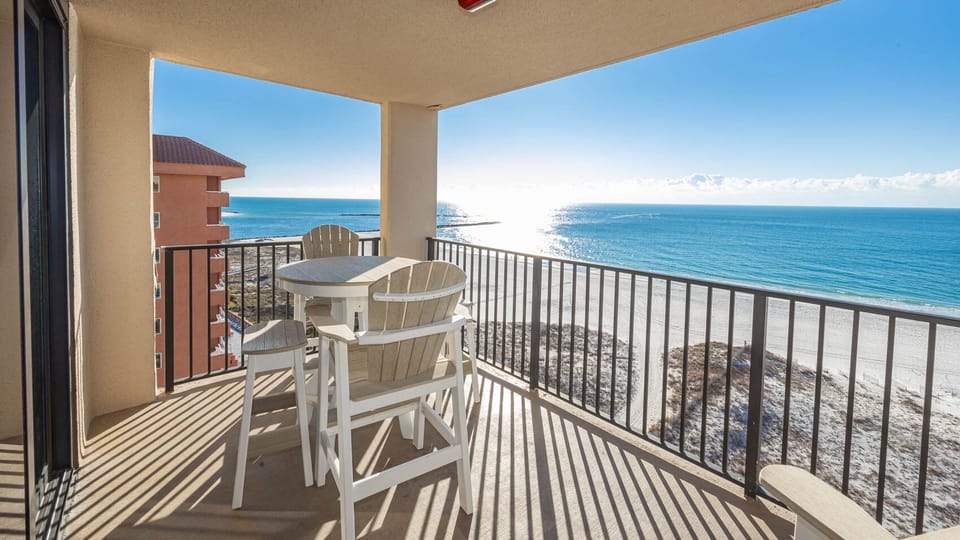 Enjoy meals or drinks while taking in the beautiful water views from this inviting balcony