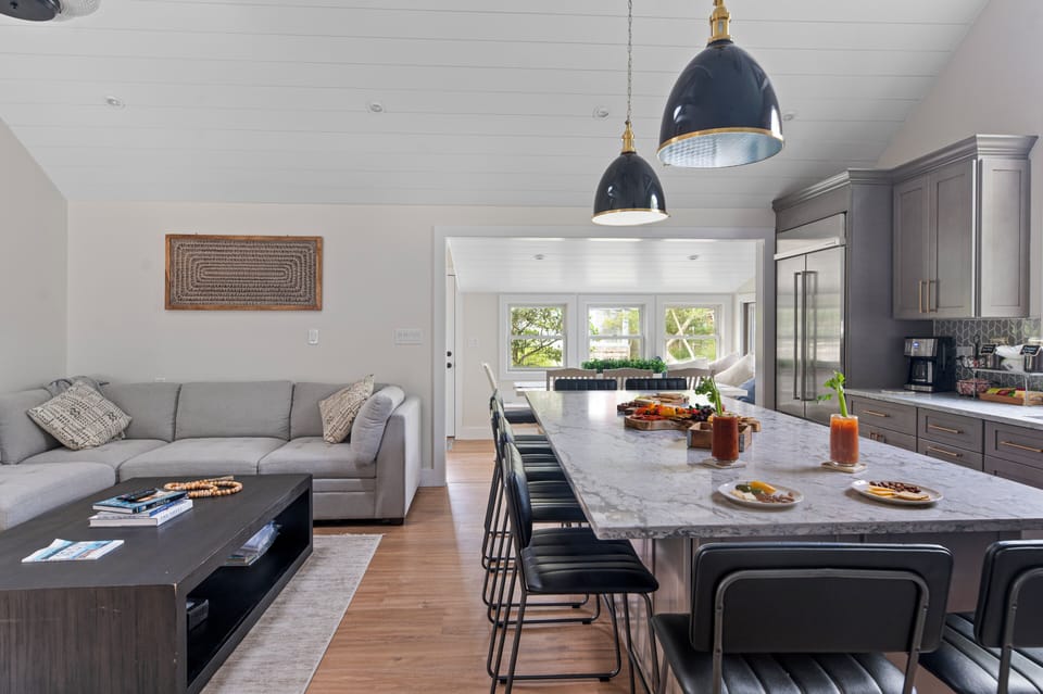 Open concept with sectional and 70" TV