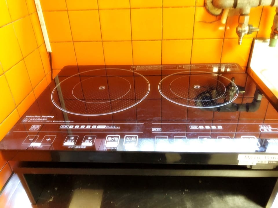 There are two IH stoves in the kitchen.