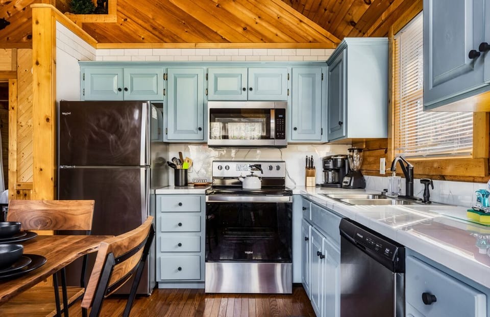 Renovated kitchen with new appliances and modern black finishes