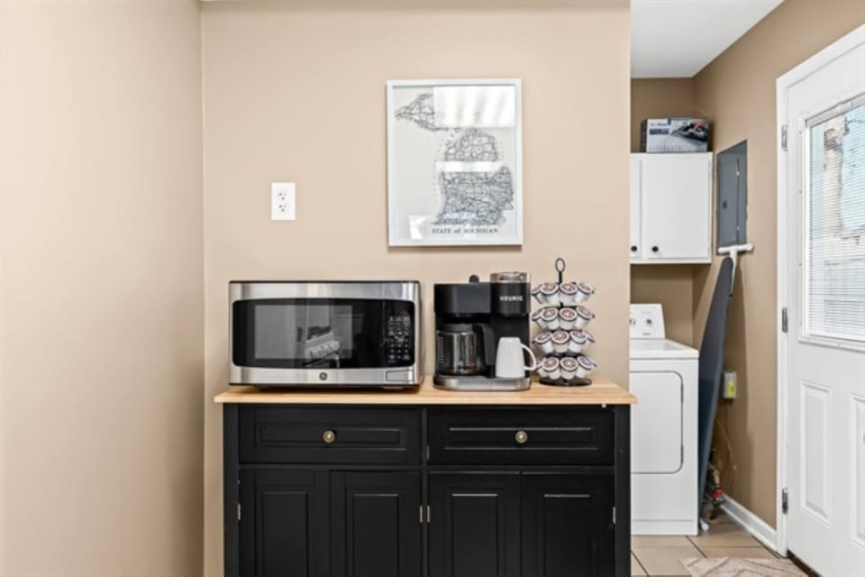 Start your day right in this convenient kitchenette, complete with modern appliances and a touch of Michigan charm