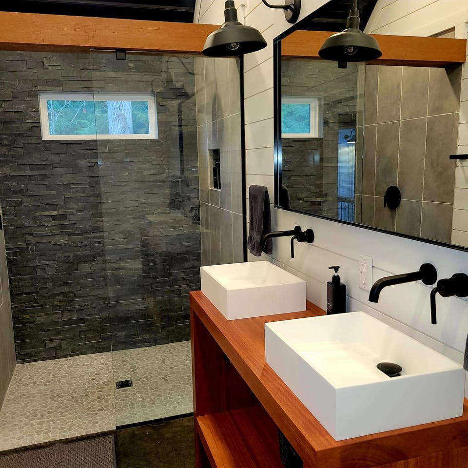 The Cali-king en-suite bathroom, featuring a large walk-in shower with gentle rain head and a custom Amish built dual vanity…with heated floors of course! 