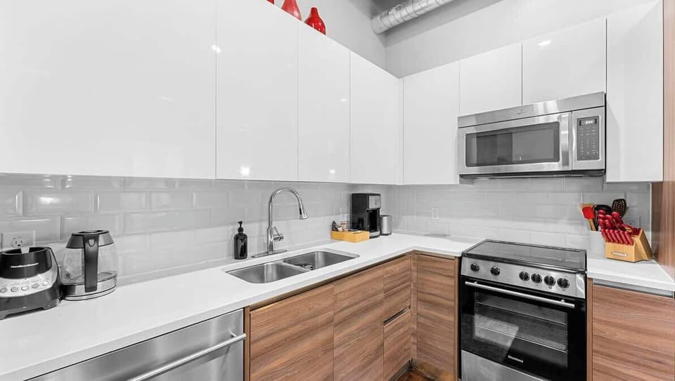 Modern Kitchen: Sleek design with stainless appliances for your culinary adventures in Dallas!