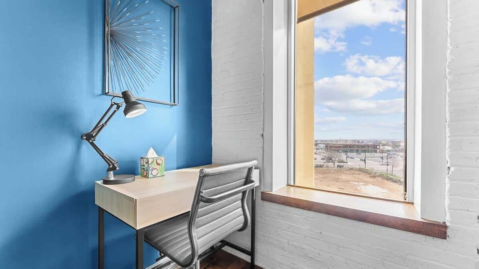Workspace Oasis: Bright desk nook with city views, perfect for inspiration and productivity!