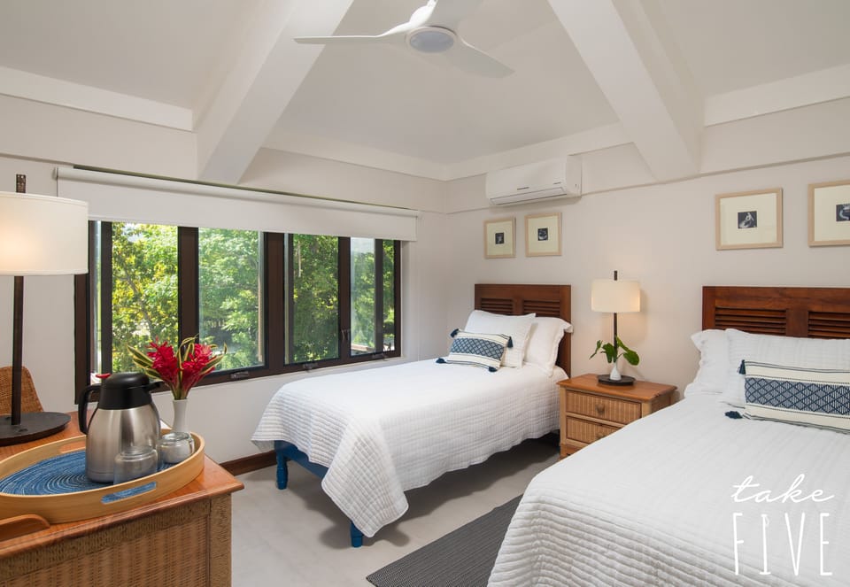 Third bedroom upstairs offers twin beds or join into a king, aircond and fan