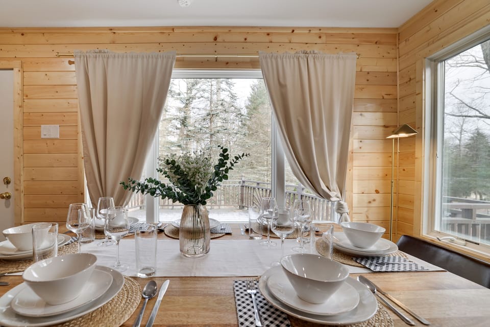 The dining table overlooks the back porch.