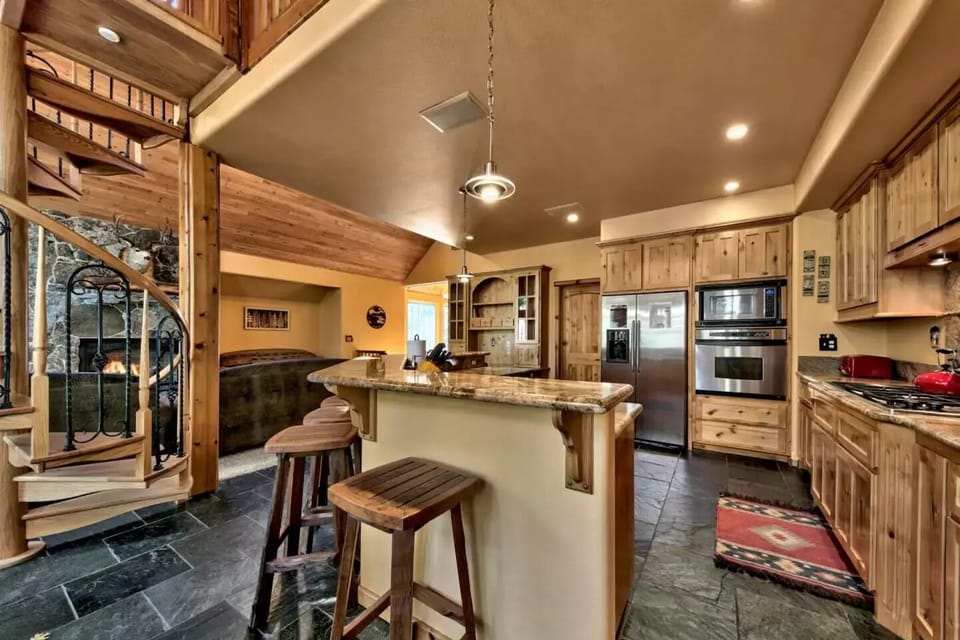 The kitchen is equipped with gas stove. There is an additional island seating.