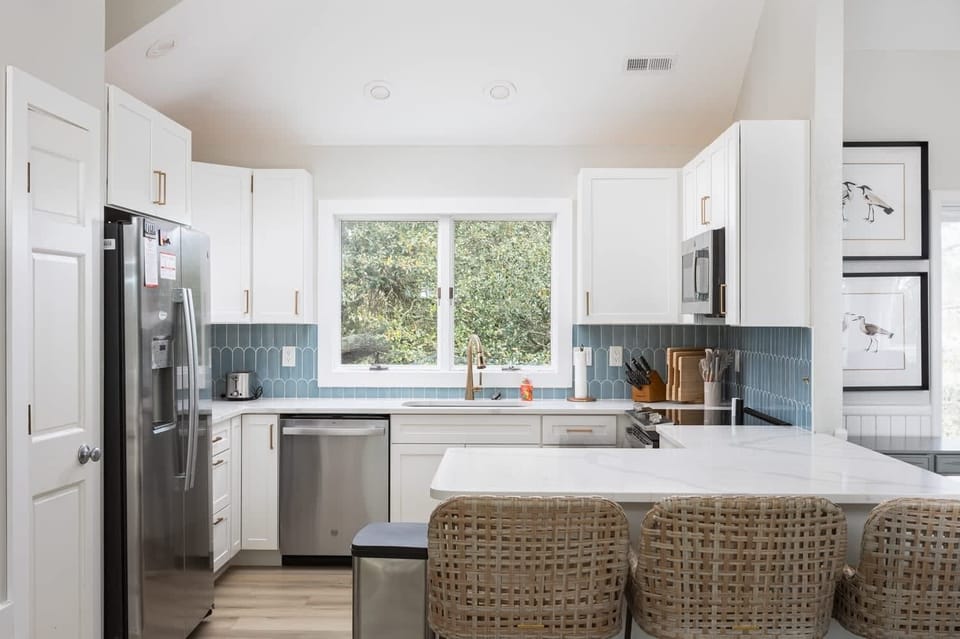 Fully Stocked Kitchen featuring breakfast seating, 3 coffee makers (Kenmore, Cuisinart and Keurig) and modern appliances (dishwasher, stove, oven, microwave, toaster, refrigerator, blender and much more)