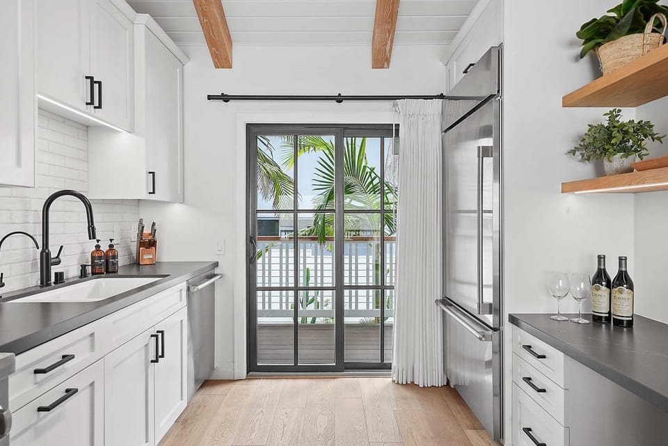 The kitchen is equipped with premium appliances and modern fixtures.