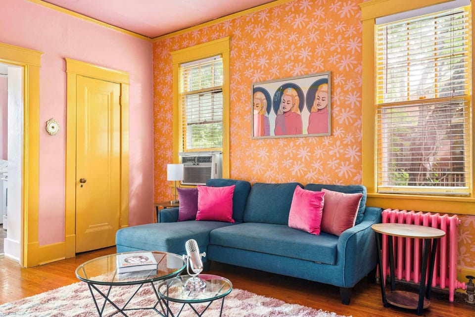 This living room doesn’t whisper—it roars in color.

Living Room (Unit B)