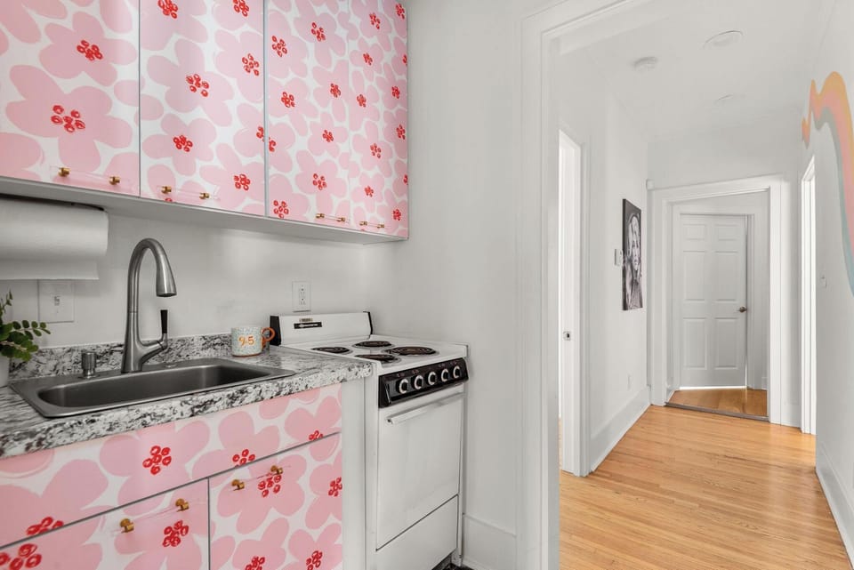 The kitchen may be small, but it's full of character!  Full sized refrigerator, oven, stove top, microwave, Keurig coffee maker.  It has everything that you'd need to cook a quick meal!