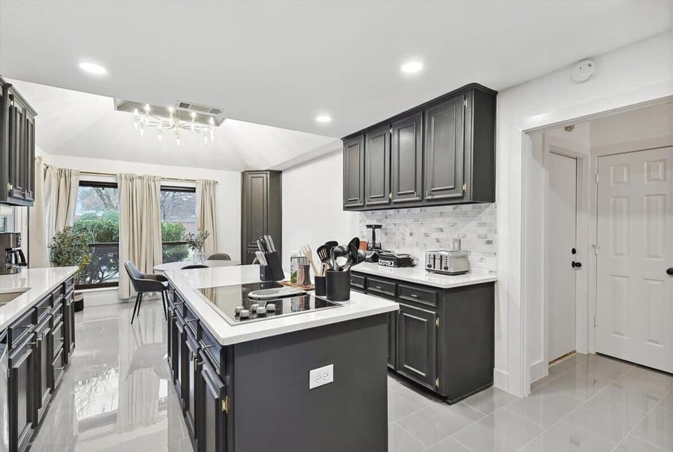 Fully equipped to serve all your cooking needs, this kitchen was designed to allow your culinary dreams to soar with expansive granite countertops and a kitchen island.