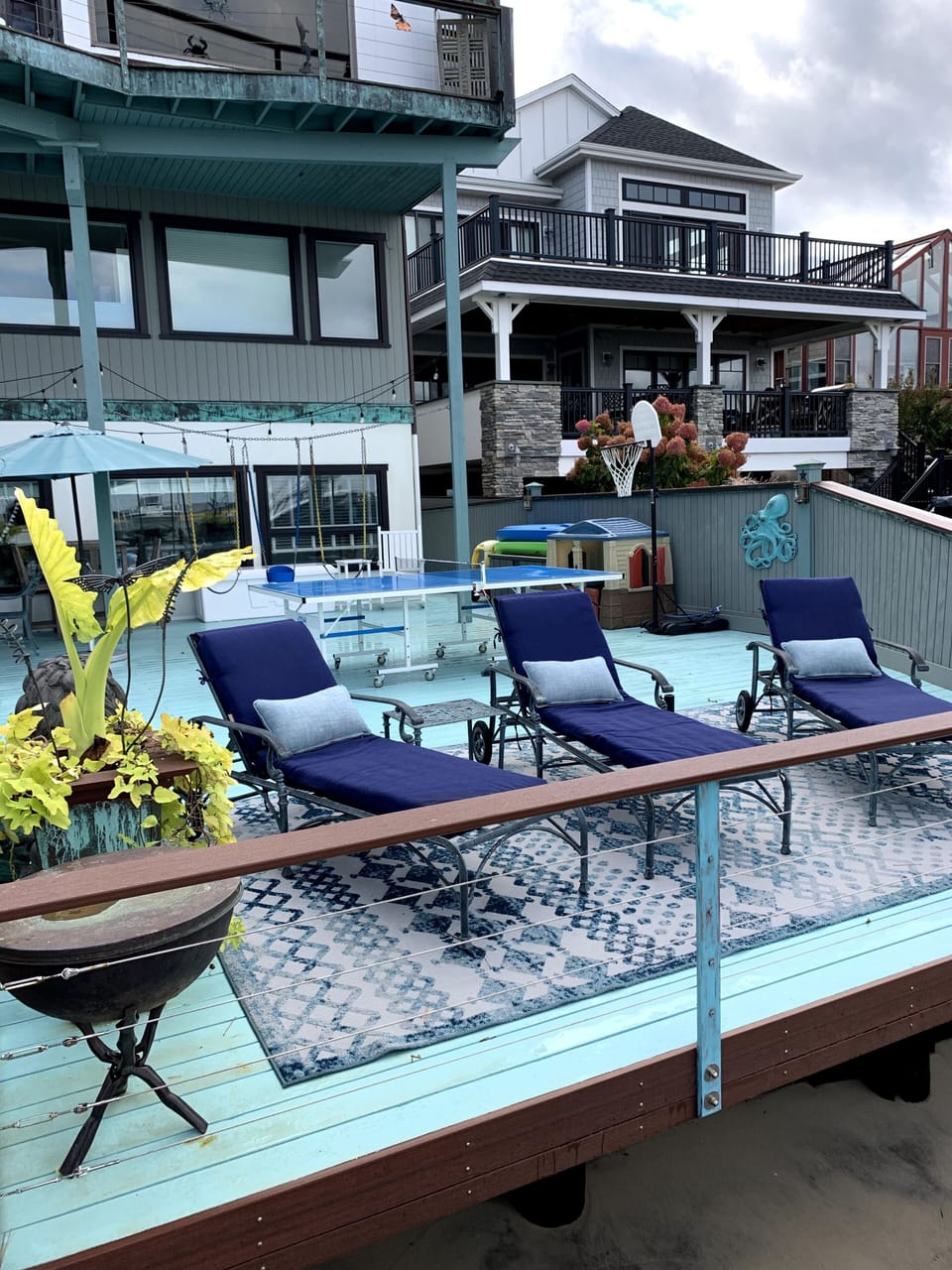Chaises on waterfront deck
