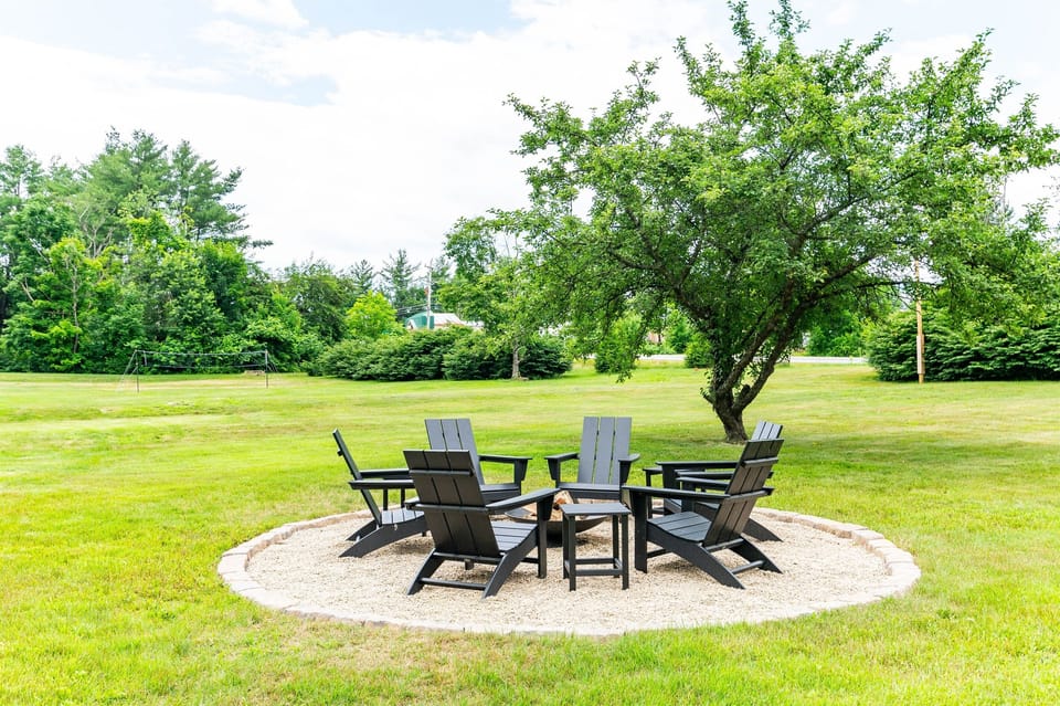 [Exterior, Fire Pit] Our fire pit area contains 6 Polywood Adirondack chairs and 3 side tables.  And don't worry.  We didn't forget the fire pokers for roasting those delicious s'mores, or the fuzzy blankets for extra warmth.  