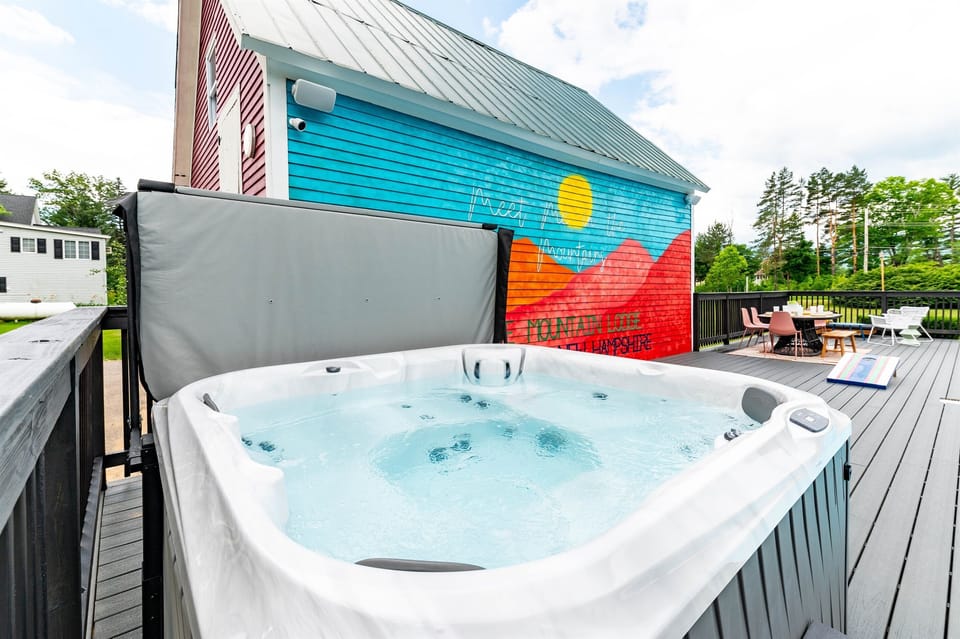 [Exterior, Pool Deck] Looking for a relaxing way to unwind after a hike in the Whites?  Our Jacuzzi hot tub will do the trick.  Feel free to bring 5 of your friends.
