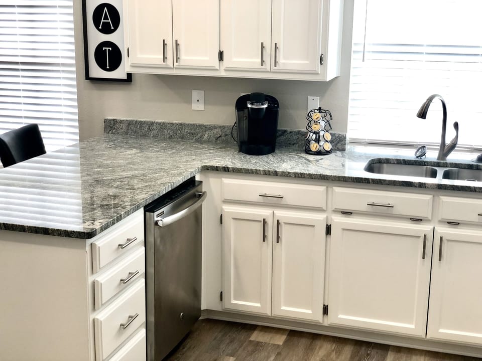 Kitchen with kuerig and complimentary pods, creamers and sweeteners