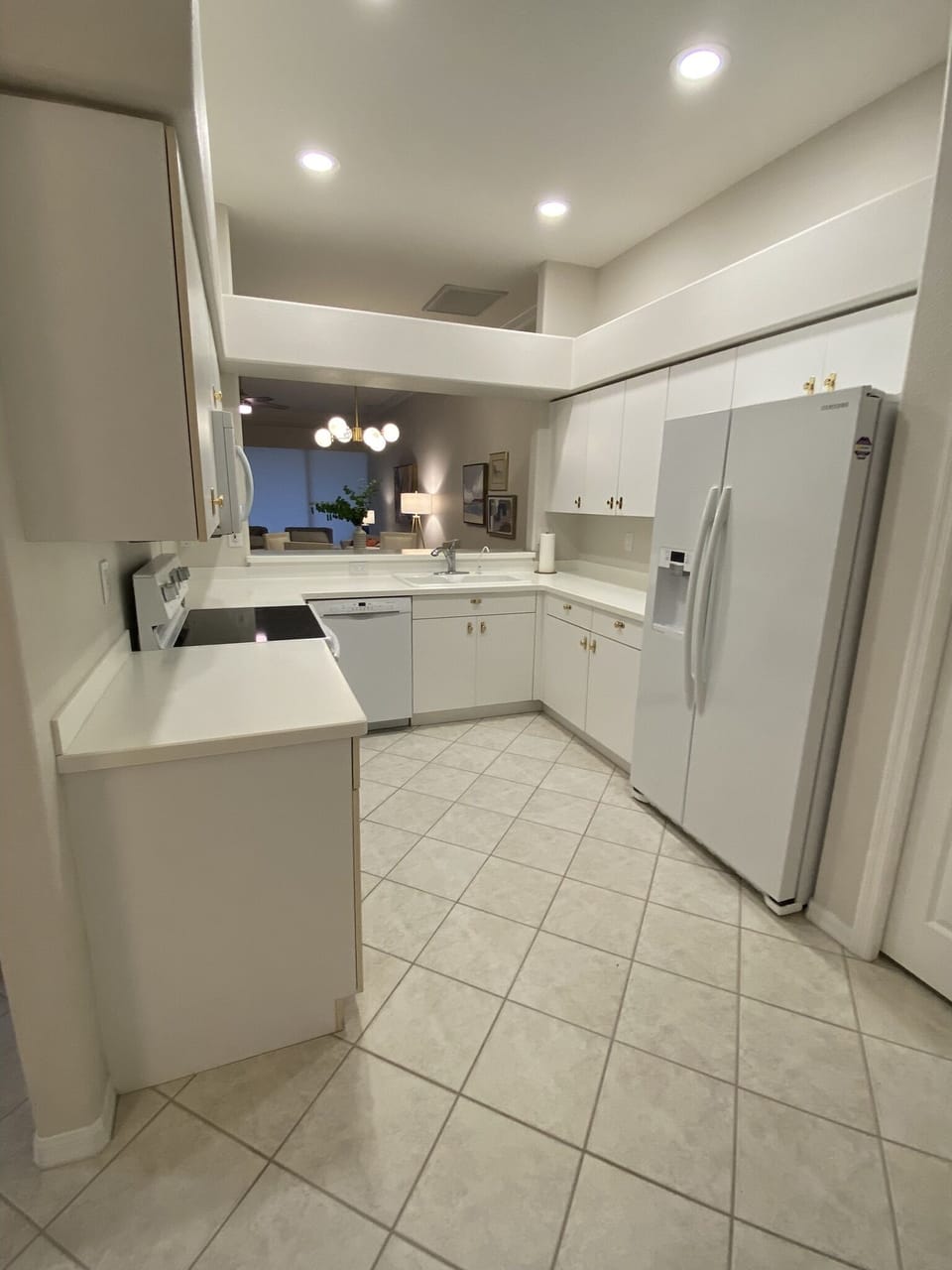 Fully equipped galley kitchen with pantry.