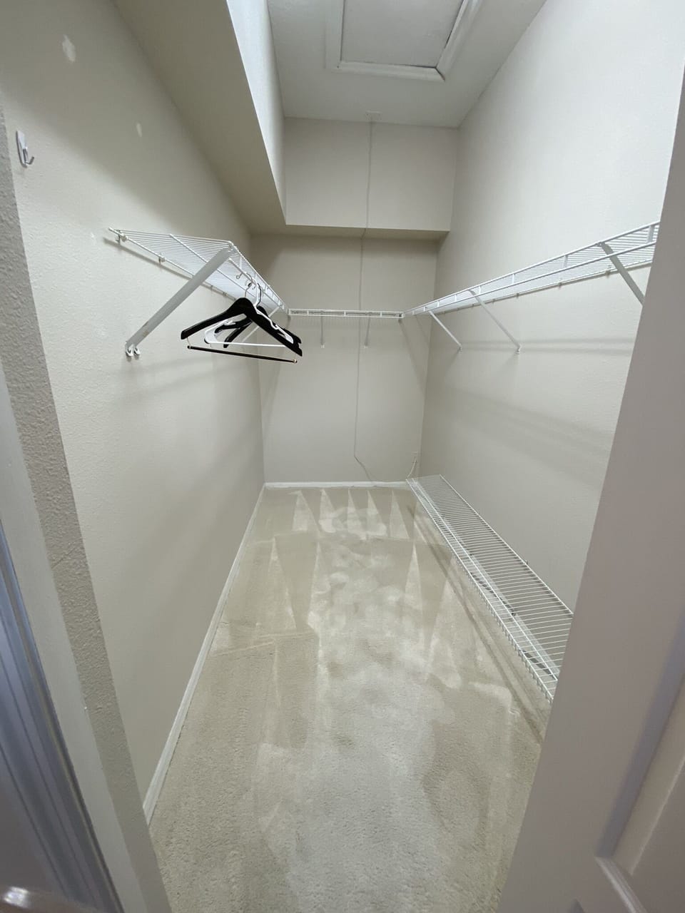 Primary bedroom walk in closet.