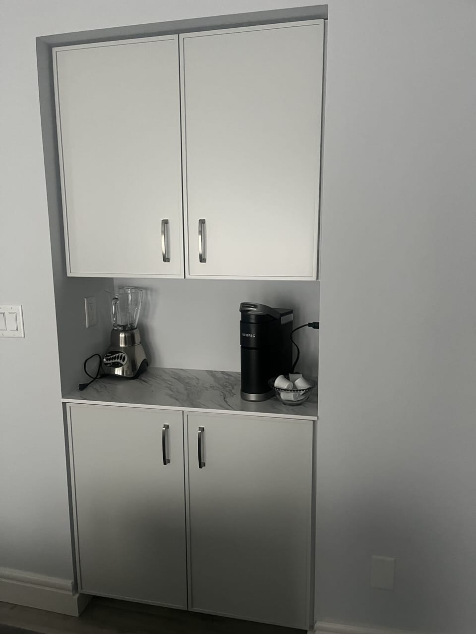 Kitchen pantry storage.  Keurig coffee maker.