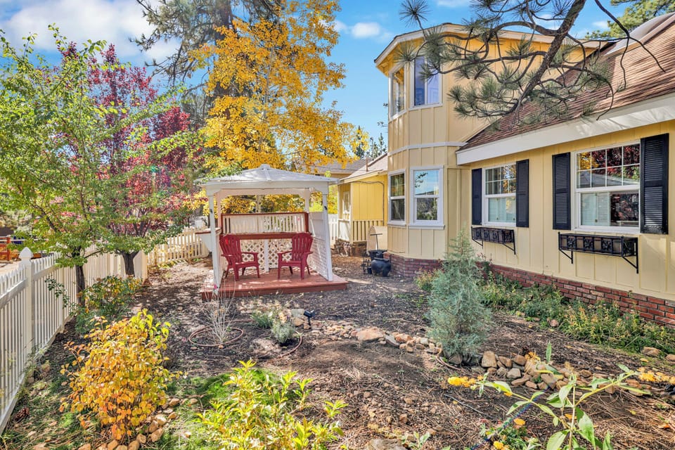 Welcoming cabin entry surrounded by towering pine trees, offering fresh mountain air and a peaceful forest setting—the perfect first impression for your Big Bear Lake getaway.