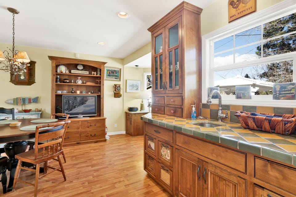 Fully equipped cabin kitchen with ample cabinetry, stove, fridge, microwave, and coffee maker—perfect for cooking meals, morning coffee, and feeling right at home on your stay.