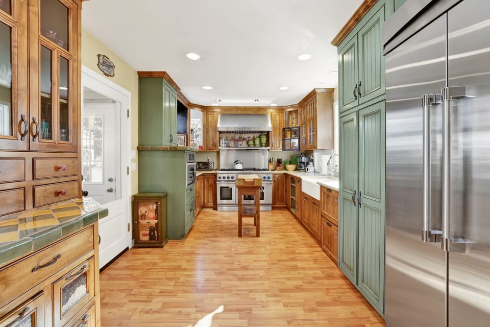 Fully equipped cabin kitchen with ample cabinetry, stove, fridge, microwave, and coffee maker—perfect for cooking meals, morning coffee, and feeling right at home on your stay.