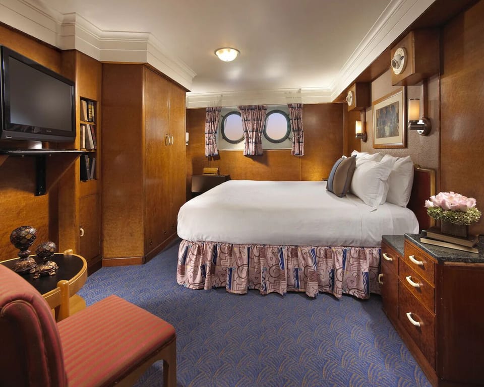 Sink into plush pillows in this warm, wood-paneled retreat.