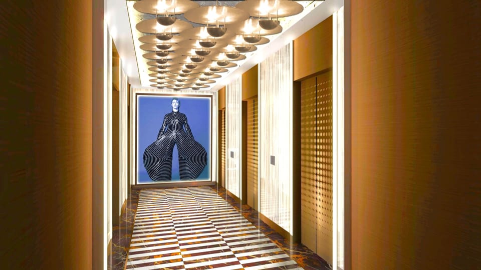 Wander through a gallery-like hallway beneath soft, golden lights.