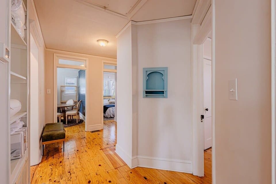 Kitchen is straight ahead, another bedroom is to the right, and then one is straight ahead.